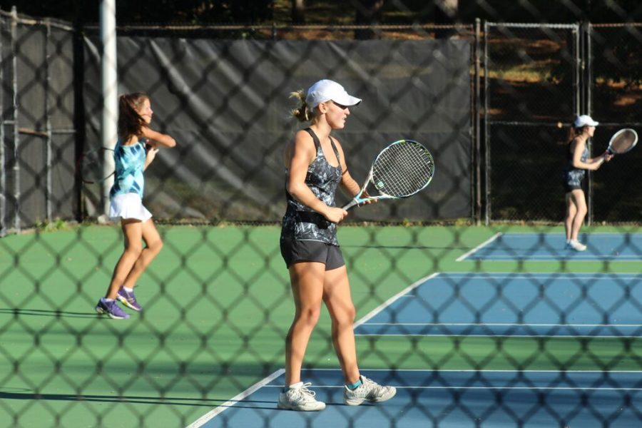 Senior Charlotte Ririe serves as varsity women’s tennis team co-captain
