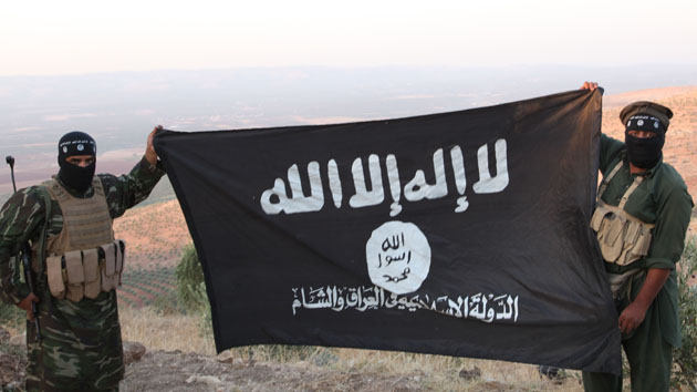 Oct 17, 2013 - Aleppo, Syria - ISIS fighters holding the Al-Qaeda flag with Islamic State of Iraq and the Levant written on it. on the frontline. Islamic State of Iraq and the Levant aka ISIS. The group An-Nusra Front announced its creation January 2012 during the Syrian Civil War. Since then it has been the most aggressive and most effective rebel force in Syria. The group has been designated as a terrorist organization by the United Nations. April 2013, the leader of the ISIS released an audio statement announcing that Jabhat al-Nusra is its branch in Syria. (Credit Image: © Medyan Dairieh/ZUMA Wire/ZUMAPRESS.com)
