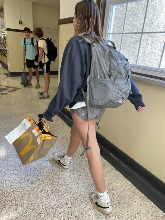 Student Caroline Lovett walks back to class as she just enjoyed a delightful meal of Door Dashed McDonald’s. 

