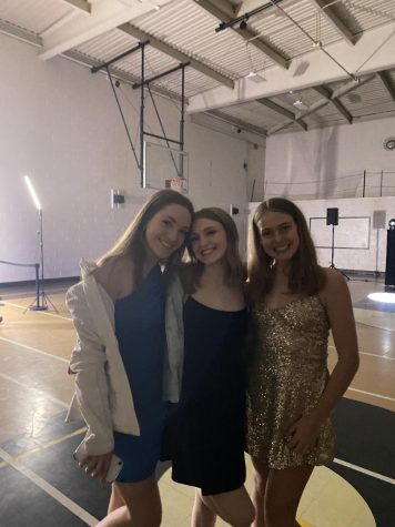 Sophomores Catherine Googe, Sophie Johnson, and Adelaide Merrick pose on the dance floor. 
