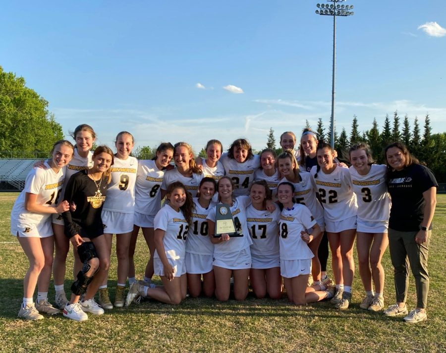 The RJR womens lacrosse team together after winning the conference tournament in 2022.