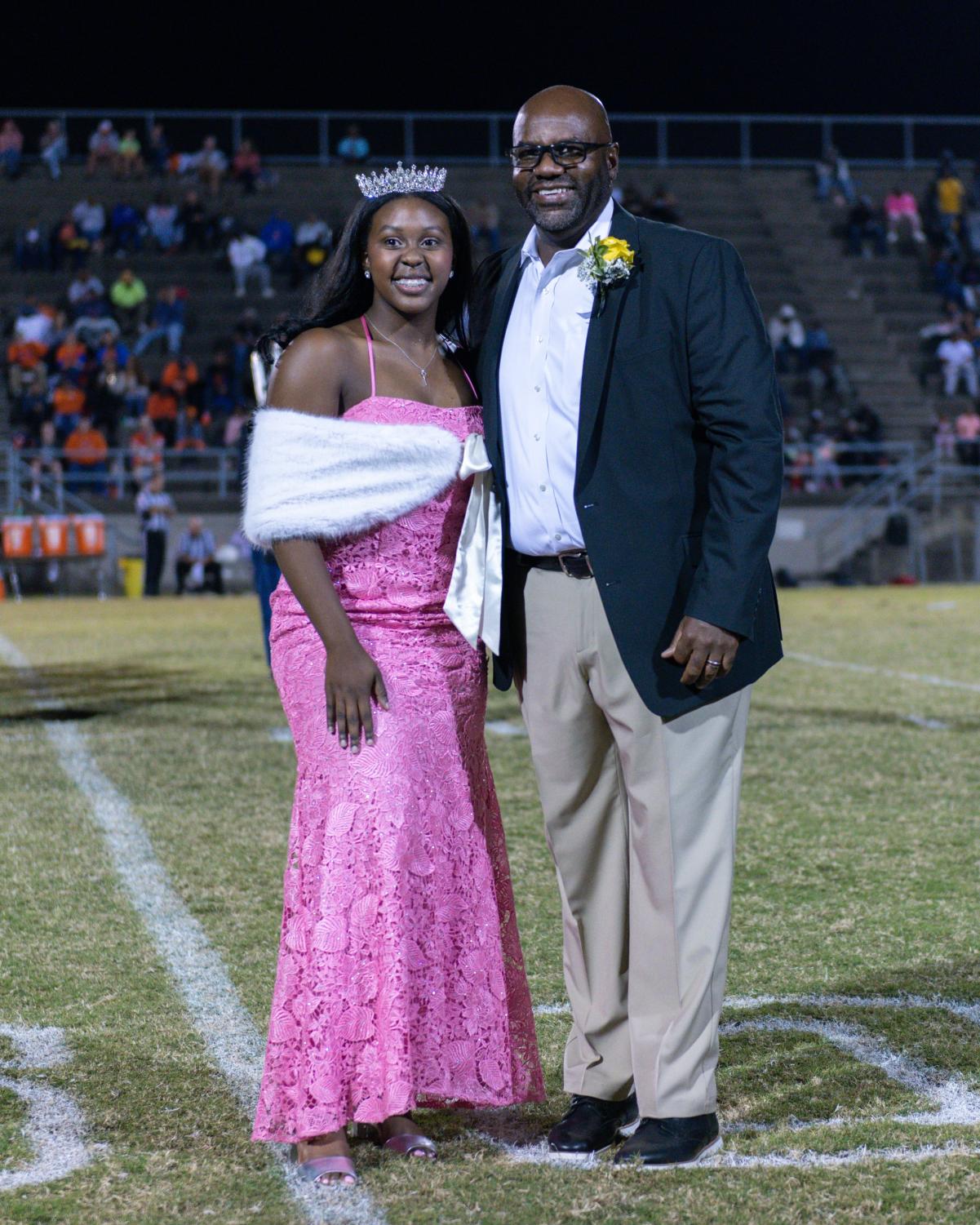 Mr. Freeman congratulates Addison Truzy on her win as Queen of Compassion and Homecoming Queen for 2022-2023.