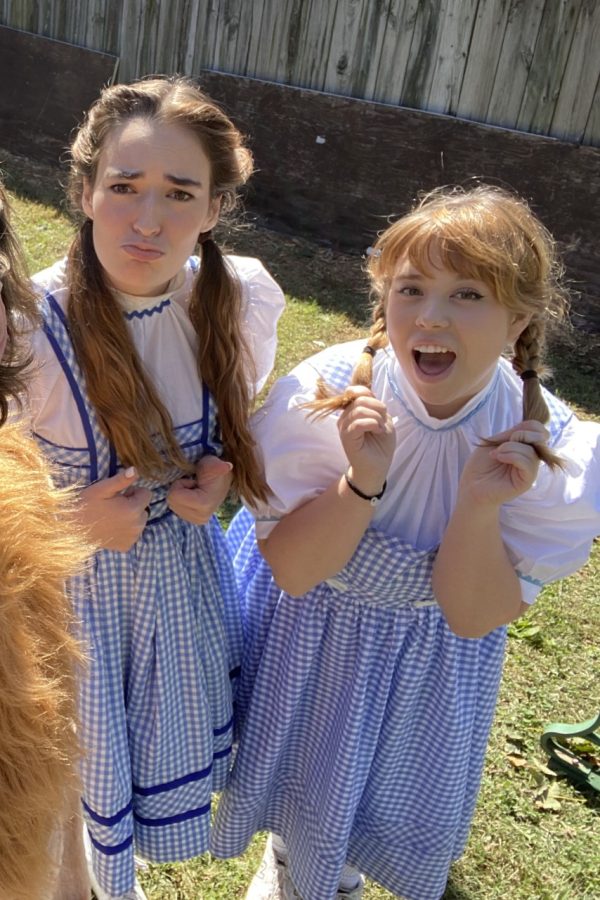 MacKenzie Clegg and Chloe Law pose in costume as Dorothy.