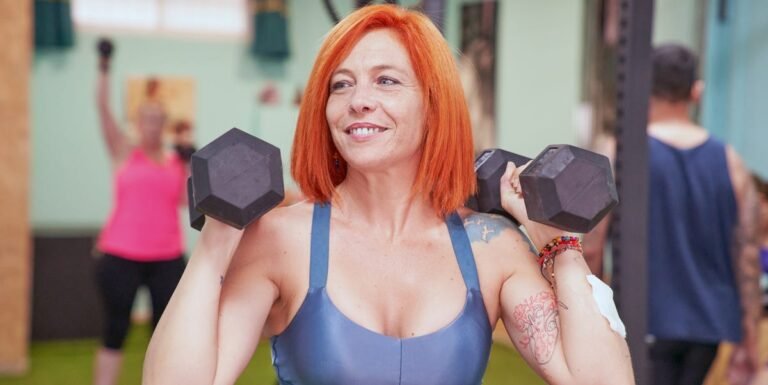 A woman over 50 lifting weights during a strength-training workout